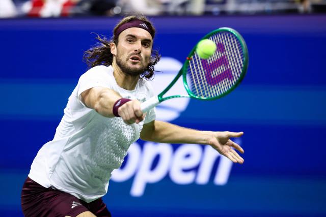 Greece's Stefanos Tsitsipas hits a backhand return during the men's singles round of 16 tennis match against USA's Ben Shelton on day eight of the US Open tennis tournament at the USTA Billie Jean King National Tennis Center in New York City on September 6, 2026. (Photo by CHARLY TRIBALLEAU / AFP)