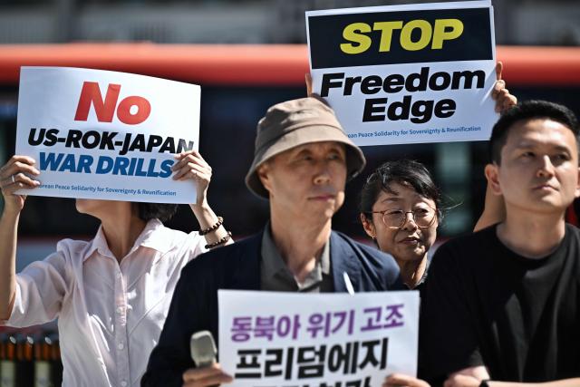 Members of the Korean Peace Solidarity for Sovereignty and Reunification protest against the South Korea, US and Japan trilateral joint military exercise “Freedom Edge”, in front of the US Embassy in Seoul on September 7, 2026. (Photo by Lillian SUWANRUMPHA / AFP)