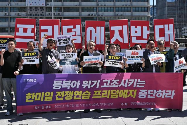 Members of the Korean Peace Solidarity for Sovereignty and Reunification protest against the South Korea, US and Japan trilateral joint military exercise “Freedom Edge”, in front of the US Embassy in Seoul on September 7, 2026. (Photo by Lillian SUWANRUMPHA / AFP)