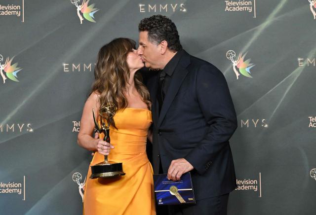 US actress Linda Cardellini, winner of Outstanding Supporting Actress in a Limited or Anthology Series or Movie for "DTF St. Louis" poses with her partner director Steve Rodriguez during Night Two of the 78th Emmy Awards at the Peacock Theater in Los Angeles on September 6, 2026. (Photo by LISA O'CONNOR / AFP)