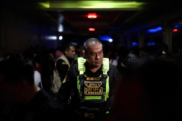 Peru's Police General Oscar Arriola takes part in the anti-human trafficking operation "Sodom and Gomorrah" at La Miel brothel in the Independencia district in Lima on July 31, 2026. The Peruvian government appointed a new police chief on September 6, 2026, to lead the fight against organized crime, one of the main challenges facing right-wing President Keiko Fujimori. "We would like to announce that National Police General Fredy Lopez Mendoza will be appointed to replace General (Óscar) Arriola in that position," said Luis Galarreta, president of the Council of Ministers, at the Government Palace, the seat of the executive branch. (Photo by Ernesto BENAVIDES / AFP)
