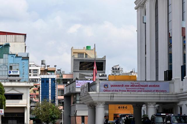 Nepal's national flag flies at half-mast as the country observes national day of mourning in the aftermath of flash floods in Kathmandu on September 7, 2026. The August 26 glacial and mountain collapse on the China-Nepal border killed at least 1,385 people, with more than 5,500 missing across the two countries. (Photo by PRAKASH MATHEMA / AFP)