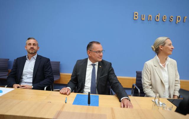 (L-R) Ulrich Siegmund, top candidate in the Saxony-Anhalt state election for the far-right Alternative for Germany (AfD) party, and his party's federal co-leaders Tino Chrupalla and Alice Weidel, address a press conference in Berlin on September 7, 2026, one day after regional elections in the eastern federal state of Saxony-Anhalt. (Photo by Odd ANDERSEN / AFP)