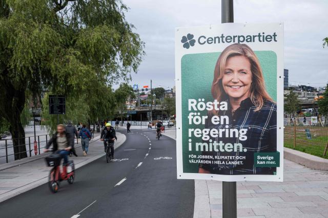 An election campaign poster featuring Centre Party leader Elisabeth Thand Ringqvist is displayed in central Stockholm, Sweden, on September 7, 2026, ahead of Sweden’s general election on September 13. (Photo by Jonathan NACKSTRAND / AFP)