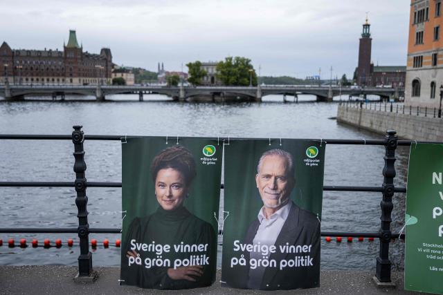Election campaign posters featuring Swedish Green Party spokespersons Amanda Lind and Daniel Helldйn are displayed in central Stockholm, Sweden, on September 7, 2026, ahead of Sweden’s general election on September 13, with Stockholm City Hall seen in the background. (Photo by Jonathan NACKSTRAND / AFP)