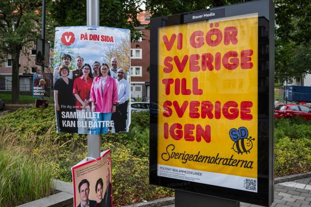 A Sweden Democrats election campaign poster reading “We make Sweden Sweden again” (R) is displayed in Sundbyberg, near Stockholm, Sweden, on September 7, 2026, ahead of Sweden’s general election on September 13. (Photo by Jonathan NACKSTRAND / AFP)