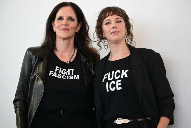 US director Rachel Lauren Mueller (R) and US documentary filmmaker Laura Poitras pose with t-shirts reading "Fuck Ice" "Fight Fascism" during the photocall of their short film "They are Here" presented out of competition at the 83rd International Venice Film Festival, at Venice Lido on September 7, 2026. (Photo by Stefano Rellandini / AFP)