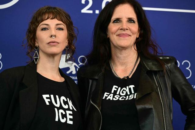 US director Rachel Lauren Mueller (L) and US documentary filmmaker Laura Poitras pose with t-shirts reading "Fuck Ice" "Fight Fascism" during the photocall of their short film "They are Here" presented out of competition at the 83rd International Venice Film Festival, at Venice Lido on September 7, 2026. (Photo by Stefano Rellandini / AFP)