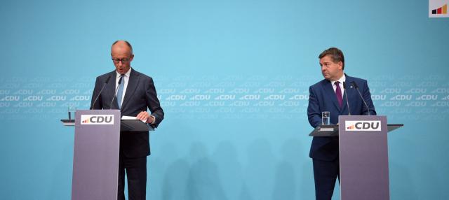 German Chancellor and leader of Germany's Christian Democratic Union (CDU) Friedrich Merz (L) and Saxony-Anhalt's State Premier Sven Schulze hold a press conference following the party's leadership meeting in Berlin on September 7, 2026, one day after regional elections in the eastern federal state of Saxony-Anhalt. (Photo by RALF HIRSCHBERGER / AFP)