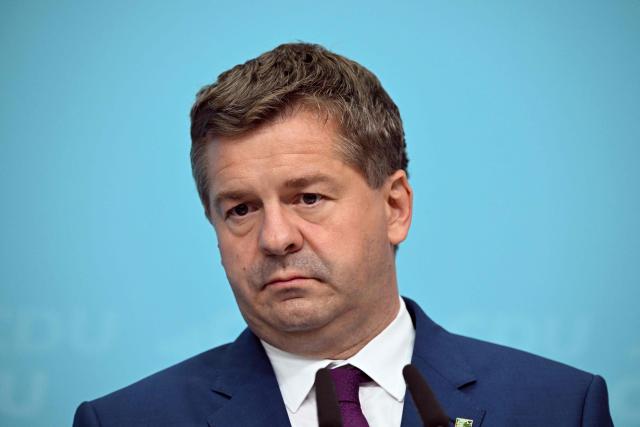 Saxony-Anhalt's State Premier Sven Schulze looks down during a press conference after the party's leadership meeting in Berlin on September 7, 2026, one day after regional elections in the eastern federal state of Saxony-Anhalt. (Photo by RALF HIRSCHBERGER / AFP)
