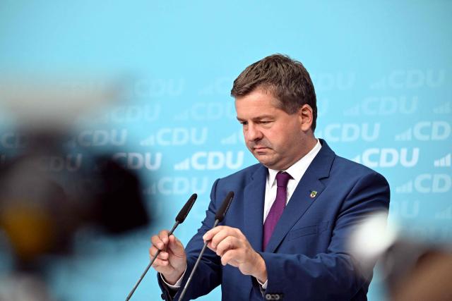 Saxony-Anhalt's State Premier Sven Schulze reacts during a press conference after the party's leadership meeting in Berlin on September 7, 2026, one day after regional elections in the eastern federal state of Saxony-Anhalt. (Photo by RALF HIRSCHBERGER / AFP)