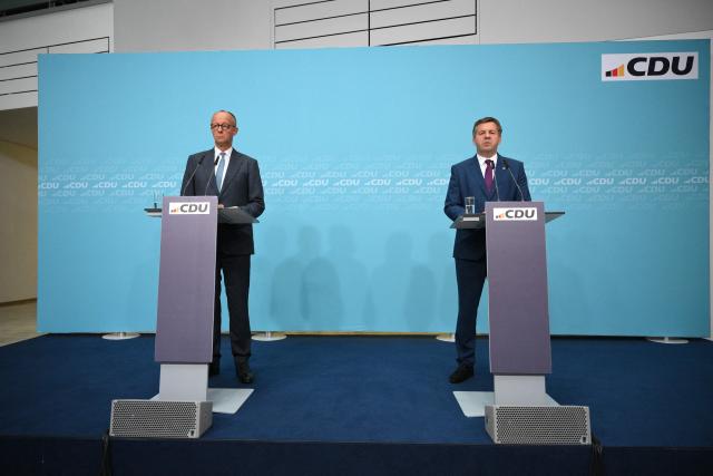 German Chancellor and leader of Germany's Christian Democratic Union (CDU) Friedrich Merz (L) and Saxony-Anhalt's State Premier Sven Schulze hold a press conference following the party's leadership meeting in Berlin on September 7, 2026, one day after regional elections in the eastern federal state of Saxony-Anhalt. (Photo by RALF HIRSCHBERGER / AFP)