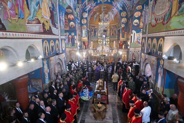 Mourners gather around the coffin of late Bosnian Serb military leader Ratko Mladic at the end of a funeral ceremony at St Lukas church in Belgrade on September 7, 2026. Mladic, 84, died last week after suffering several strokes while serving a life sentence in The Hague for war crimes committed during the 1990s war in Bosnia. (Photo by OLIVER BUNIC / AFP)