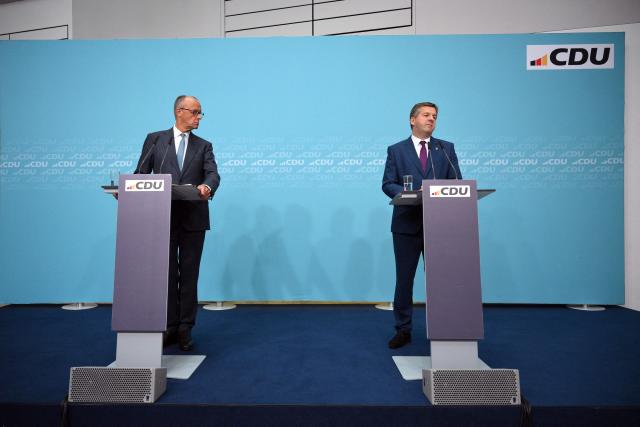 German Chancellor and leader of Germany's Christian Democratic Union (CDU) Friedrich Merz (L) and Saxony-Anhalt's State Premier Sven Schulze hold a press conference following the party's leadership meeting in Berlin on September 7, 2026, one day after regional elections in the eastern federal state of Saxony-Anhalt. (Photo by RALF HIRSCHBERGER / AFP)