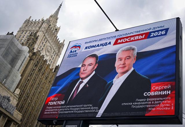 This photograph shows Russian Foreign Ministry building and a campaign poster for the election to the Russian State Duma (lower house of Russia's Parliament), depicting Moscow mayor Sergei Sobyanin (R) and Duma's Vice Speaker Pyotr Tolstoy in Moscow on September 7, 2026. Russia will vote for the Duma's election on September 18-20, 2026. (Photo by Alexander NEMENOV / AFP)