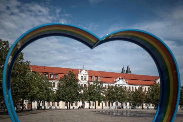 A general view taken on September 7, 2026 in Magdeburg, eastern Germany, shows a heart-shaped sculpture in rainbow colours at the Cathedral Square in front of Saxony-Anhalt's State Parliament, the day after the state election. German Chancellor Merz said on September 7 he was "deeply shocked" by his party's state election defeat at the hands of the far-right AfD but vowed to stay the course with tough reforms while seeking to explain them better. (Photo by Ronny HARTMANN / AFP)