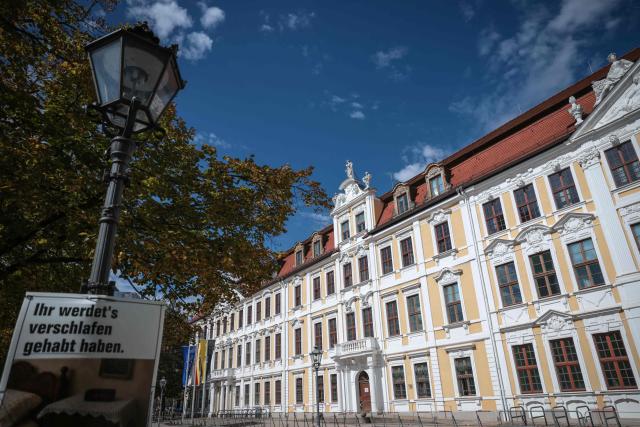 An election poster from 'Die Partei' bearing the slogan 'You must have slept through it' (Ihr werdet's verschlafen gehabt haben) is seen on a lamppost in front of Saxony-Anhalt's State Parliament in Magdeburg, eastern Germany, on September 7, 2026, the day after the state election. German Chancellor Merz said on September 7 he was "deeply shocked" by his party's state election defeat at the hands of the far-right AfD but vowed to stay the course with tough reforms while seeking to explain them better. (Photo by Ronny HARTMANN / AFP)