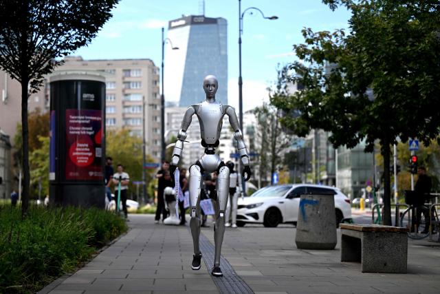 A humanoid robot arrives to attend a demonstration calling for the regulation of artificial intelligence development in Warsaw on September 7, 2026. Waving flags, "chanting" slogans, and marching in circles -- around thirty robots took to the streets to raise awareness for AI regulation in front of the digital affairs ministry on September 7, 2026. (Photo by Sergei GAPON / AFP)