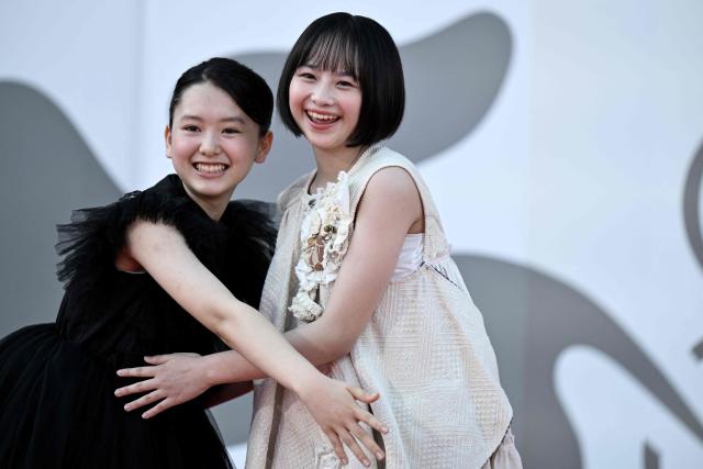Furi Nanase and Rokka Okada attend the red carpet event of "Look Back" presented in competition at the 83rd International Venice Film Festival, at Venice Lido on September 7, 2026. (Photo by Tiziana FABI / AFP)