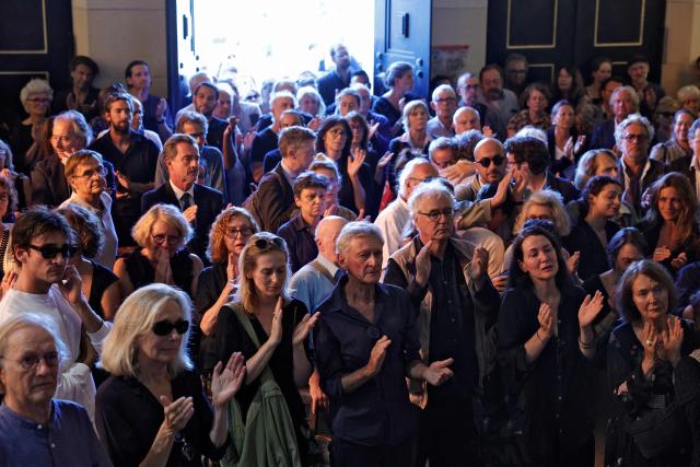 People applaud at the start of the funeral ceremony of Jean-Francois Leroy, founder and longtime director of the Visa pour l'Image international photojournalism festival, at the Pere Lachaise cemetery in Paris on September 7, 2026. Jean-Francois Leroy passed away of cancer at the age of 69 on August 31, 2026 at the start of the 38th edition of the Visa pour l'Image photojournalism festival in Perpignan, which he founded in 1989. (Photo by GEOFFROY VAN DER HASSELT / AFP)