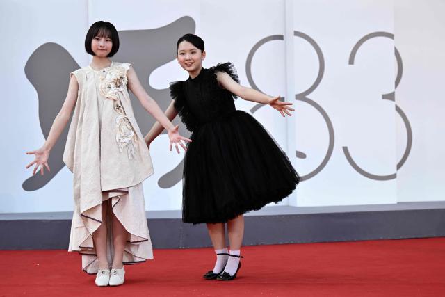Furi Nanase and Rokka Okada attend the red carpet event of "Look Back" presented in competition at the 83rd International Venice Film Festival, at Venice Lido on September 7, 2026. (Photo by Tiziana FABI / AFP)