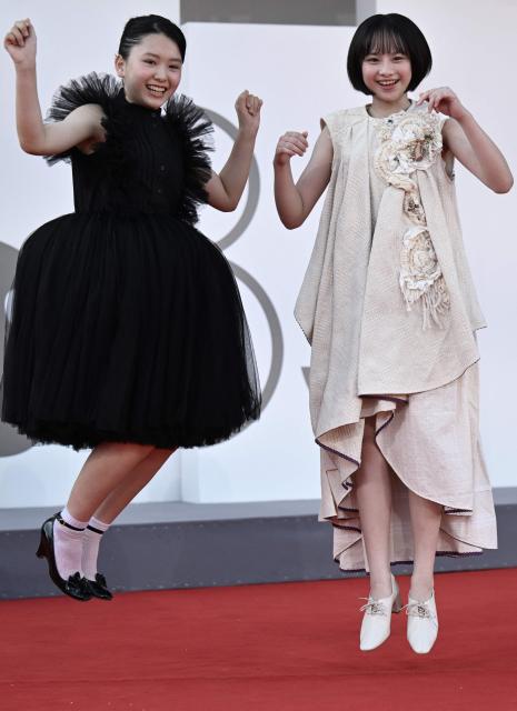 Furi Nanase and Rokka Okada attend the red carpet event of "Look Back" presented in competition at the 83rd International Venice Film Festival, at Venice Lido on September 7, 2026. (Photo by Tiziana FABI / AFP)