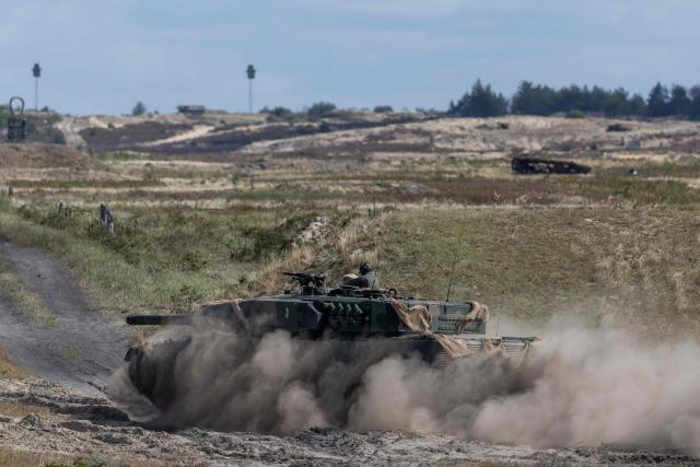 A Polish Army's Germany-made Leopard 2PL tank drives during a demonstration of the Polish Army Training at the military training ground in Nowa Deba on September 7, 2026, on the eve of the 34th International Defence Industry Exhibition. The 34th International Defence Industry Exhibition runs from September 8 to 11, 2026 in Kielce, Poland. (Photo by Wojtek RADWANSKI / AFP)