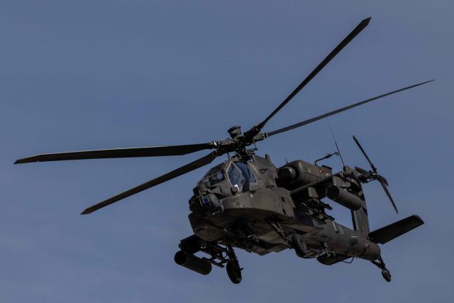 A Polish Air Forces US-made AH-6h Apache helicopter flies during a demonstration of Polish Army training at the military training ground in Nowa Deba, Poland on September 7, 2026, on the eve of the 34th International Defence Industry Exhibition. The 34th International Defence Industry Exhibition runs from September 8 to 11, 2026 in Kielce, Poland. (Photo by Wojtek RADWANSKI / AFP)