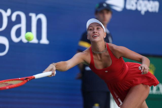 Austria's Anastasia Potapova reaches to hit a return against Russia's Mirra Andreeva during their women's singles round of 16 tennis match on day nine of the US Open tennis tournament at the USTA Billie Jean King National Tennis Center in New York City on September 7, 2026. (Photo by TIMOTHY A. CLARY / AFP)