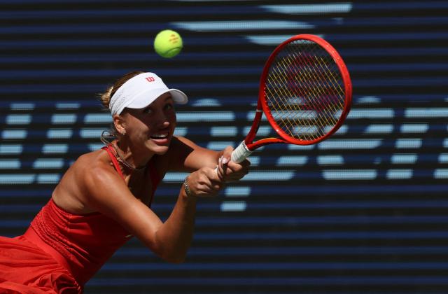 Austria's Anastasia Potapova hits a return against Russia's Mirra Andreeva during their women's singles round of 16 tennis match on day nine of the US Open tennis tournament at the USTA Billie Jean King National Tennis Center in New York City on September 7, 2026. (Photo by TIMOTHY A. CLARY / AFP)