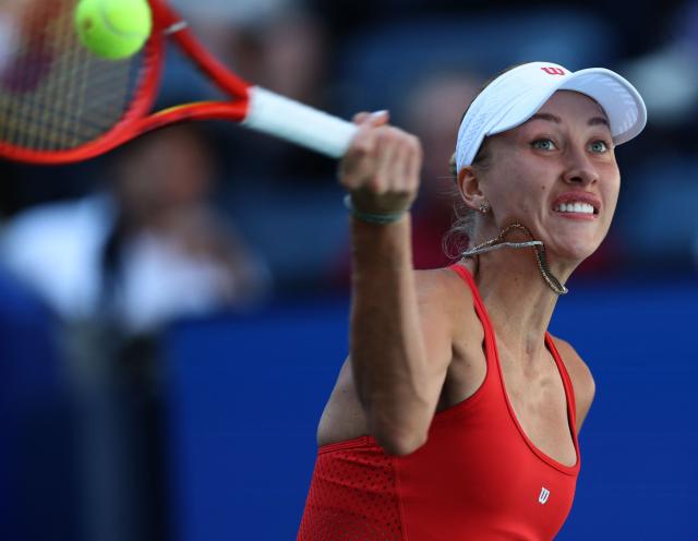 Austria's Anastasia Potapova hits a return against Russia's Mirra Andreeva during their women's singles round of 16 tennis match on day nine of the US Open tennis tournament at the USTA Billie Jean King National Tennis Center in New York City on September 7, 2026. (Photo by TIMOTHY A. CLARY / AFP)