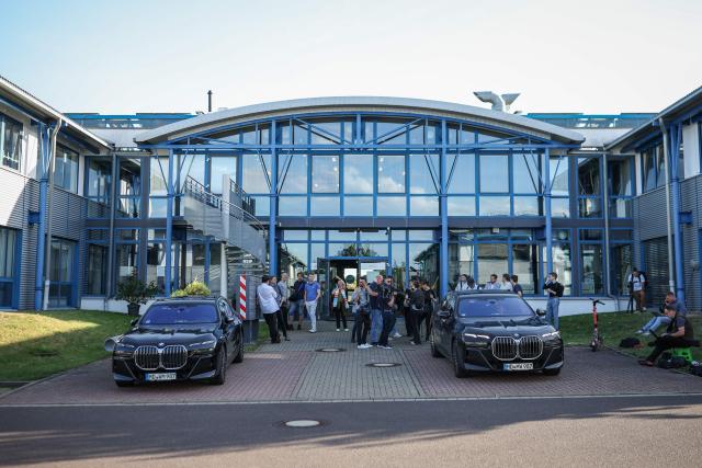 Journalists wait in front of a building where the meeting of the conservative Christian Democratic Union (CDU) party is held on the aftermath of the state election in Saxony-Anhalt, on September 7, 2026 in the GTZH Industry Park in Magdeburg. German Chancellor Friedrich Merz's conservatives licked their wounds September 7, 2026 after a crushing state election defeat in the ex-communist east, as the triumphant far-right AfD launched a withering attack against him. (Photo by Ronny HARTMANN / AFP)