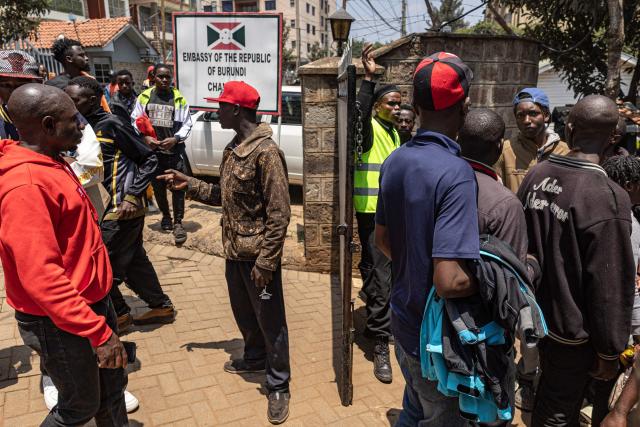 Burundian nationals gather outside their embassy to apply for border passes as they prepare to travel back to their country following the Kenyan government’s directive on undocumented small-scale traders, in Nairobi on September 7, 2026. (Photo by SIMON MAINA / AFP)