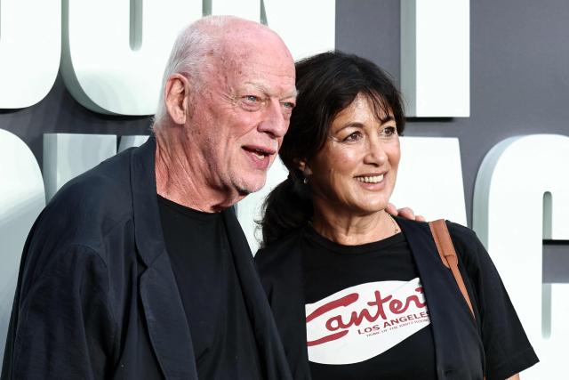 British Musician and lead guitarist with Pink Floyd, David Gilmour, and his wife Novelist Polly Samson pose upon arrival on the red carpet for the UK premiere of the film 'Oasis: Don't Look Back In Anger', in Leicester Square in central London on September 7, 2026. (Photo by Henry NICHOLLS / AFP)