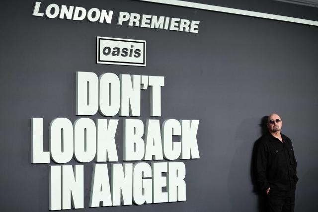 British Musician Paul "Bonehead" Arthurs poses upon arrival on the red carpet for the UK premiere of the film 'Oasis: Don't Look Back In Anger', in Leicester Square in central London on September 7, 2026. (Photo by Henry NICHOLLS / AFP)