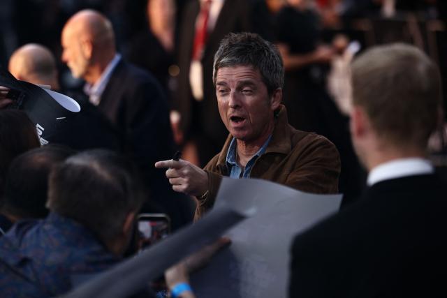 British Musician and Oasis singer Noel Gallagher signs autographs as her arrives to attend the UK premiere of the film 'Oasis: Don't Look Back In Anger', in Leicester Square in central London on September 7, 2026. (Photo by Henry NICHOLLS / AFP)