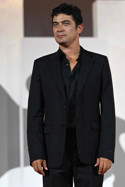 Italian actor Riccardo Scamarcio, cast member of 'I figli della scimmia", attends the red carpet event of "L’estranea" (The Spiral) presented in competition at the 83rd International Venice Film Festival, at Venice Lido on September 7, 2026. (Photo by Tiziana FABI / AFP)