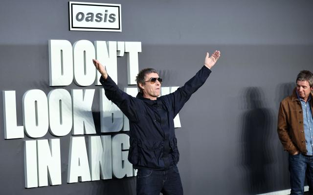 British Musicians and Oasis singers Noel Gallagher (R) reacts as his brother Liam Gallagher gestures at photographers on the red carpet for the UK premiere of the film 'Oasis: Don't Look Back In Anger', in Leicester Square in central London on September 7, 2026. (Photo by Henry NICHOLLS / AFP)