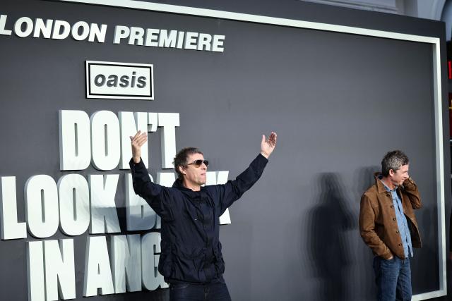 British Musicians and Oasis singers Noel Gallagher (R) reacts as his brother Liam Gallagher gestures at photographers on the red carpet for the UK premiere of the film 'Oasis: Don't Look Back In Anger', in Leicester Square in central London on September 7, 2026. (Photo by Henry NICHOLLS / AFP)