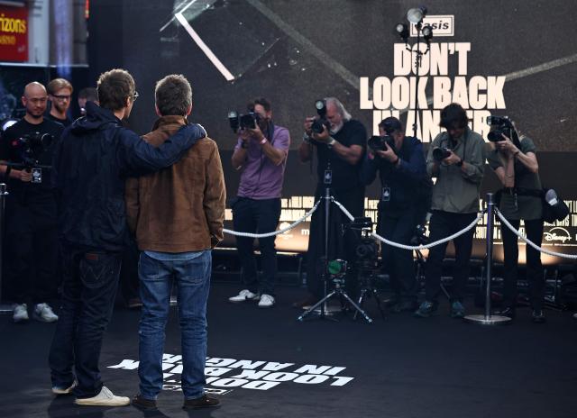 British Musicians and Oasis singers Liam Gallagher (L) Noel Gallagher pose for selected media as they arrive for the UK premiere of the film 'Oasis: Don't Look Back In Anger', in Leicester Square in central London on September 7, 2026. (Photo by Henry NICHOLLS / AFP)