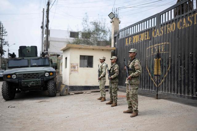 Army officers guard the Miguel Castro Castro penitentiary center, located in the San Juan de Lurigancho district on the eastern outskirts of Lima on September 7, 2027. The Peruvian government declared a state of emergency in five prisons, a measure that authorizes the military, together with the police, to take charge of external control of the facilities, the presidency said on September 5, 2026. (Photo by Ernesto BENAVIDES / AFP)