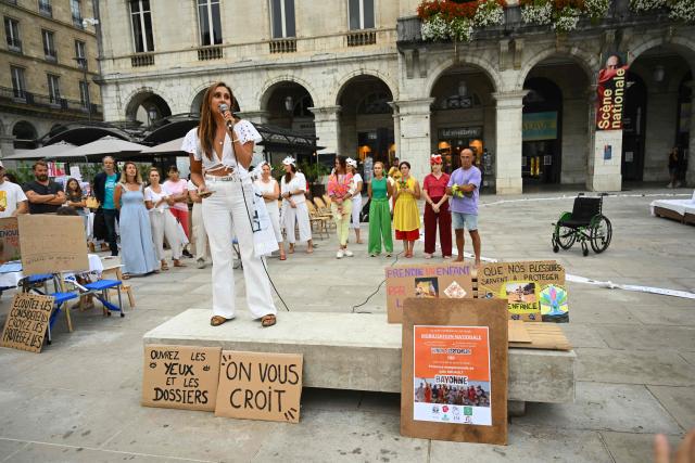 Demonstrators gather to take part in a protest against sexual violence on the day of the examination by a special committee of the National Assembly of a Bill for the protection of women and children, outside the City Hall in Bayonne on September 7, 2026. Following the Lyhanna case- involving an 11-year-old middle school student found raped and murdered in June - a highly anticipated "comprehensive" bill aiming to address the entire spectrum of violence (identification, prevention, support, the justice system and the monitoring of both perpetrators and victims) began its legislative journey on September 7, 2026, being reviewed by a special committee at the National Assembly ahead of its presentation to Parliament in early October. (Photo by Gaizka IROZ / AFP)