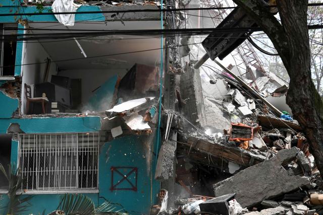 Heavy machinery demolishes the damaged Maria Mercedes Lloreda building 37 days after a 7.4 earthquake in the Cuarto de Legua neighborhood in Cali, Colombia on September 7, 2026. (Photo by JOAQUIN SARMIENTO / AFP)