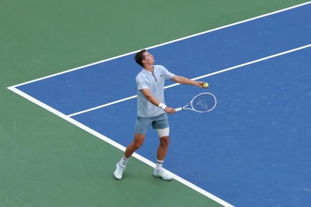 Belgium's Alexander Blockx serves to Argentina's Francisco Cerundolo in their men's singles round of 16 tennis match on day nine of the US Open tennis tournament at the USTA Billie Jean King National Tennis Center in New York on September 7, 2026. (Photo by KENA BETANCUR / AFP)