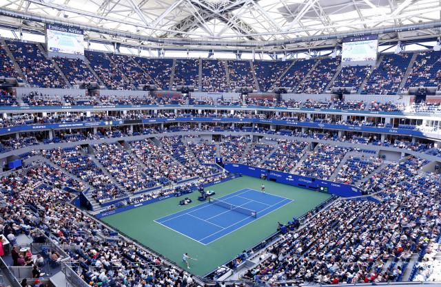 Argentina's Francisco Cerundolo (R) and Belgium's Alexander Blockx play during the men's singles round of 16 tennis match on day nine of the US Open tennis tournament at the USTA Billie Jean King National Tennis Center in New York City on September 7, 2026. (Photo by kena betancur / AFP)