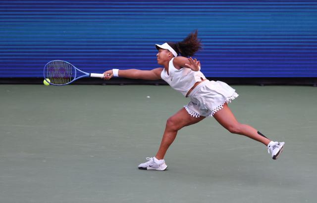 Japan's Naomi Osaka reaches to return the ball to Kazakhstan's Elena Rybakina during the women's singles round of 16 tennis match on day nine of the US Open tennis tournament at the USTA Billie Jean King National Tennis Center in New York City on September 7, 2026. (Photo by TIMOTHY A. CLARY / AFP)