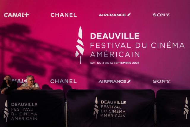 People wait for the opening of the red carpet for the 52nd edition of the Deauville American film festival, in Deauville, northwestern France, on September 7, 2026. (Photo by Guillaume SALIGOT / AFP)