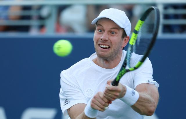 Netherlands' Botic van de Zandschulp returns the ball to France's Arthur Gea during the men's singles round of 16 tennis match on day nine of the US Open tennis tournament at the USTA Billie Jean King National Tennis Center in New York City on September 7, 2026. (Photo by Leonardo MUNOZ / AFP)
