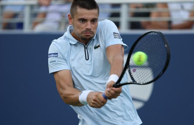 France's Arthur Gea hits a return to Netherlands' Botic van de Zandschulp during their men's singles round of 16 tennis match on day nine of the US Open tennis tournament at the USTA Billie Jean King National Tennis Center in New York on September 7, 2026. (Photo by Leonardo MUNOZ / AFP)
