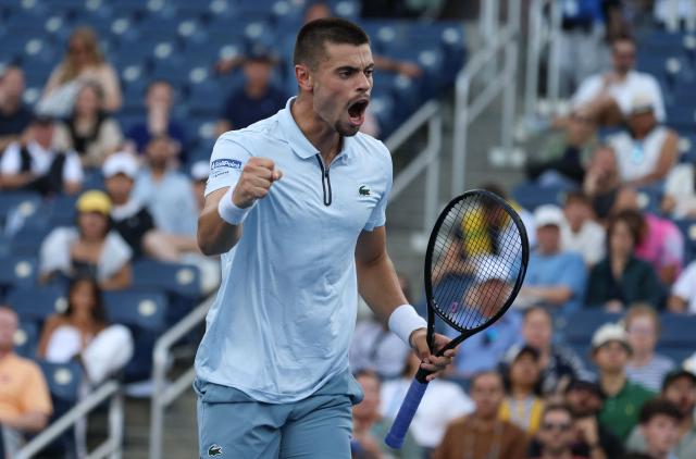 France's Arthur Gea reacts as he plays Netherlands' Botic van de Zandschulp in their men's singles round of 16 tennis match on day nine of the US Open tennis tournament at the USTA Billie Jean King National Tennis Center in New York on September 7, 2026. (Photo by Leonardo MUNOZ / AFP)
